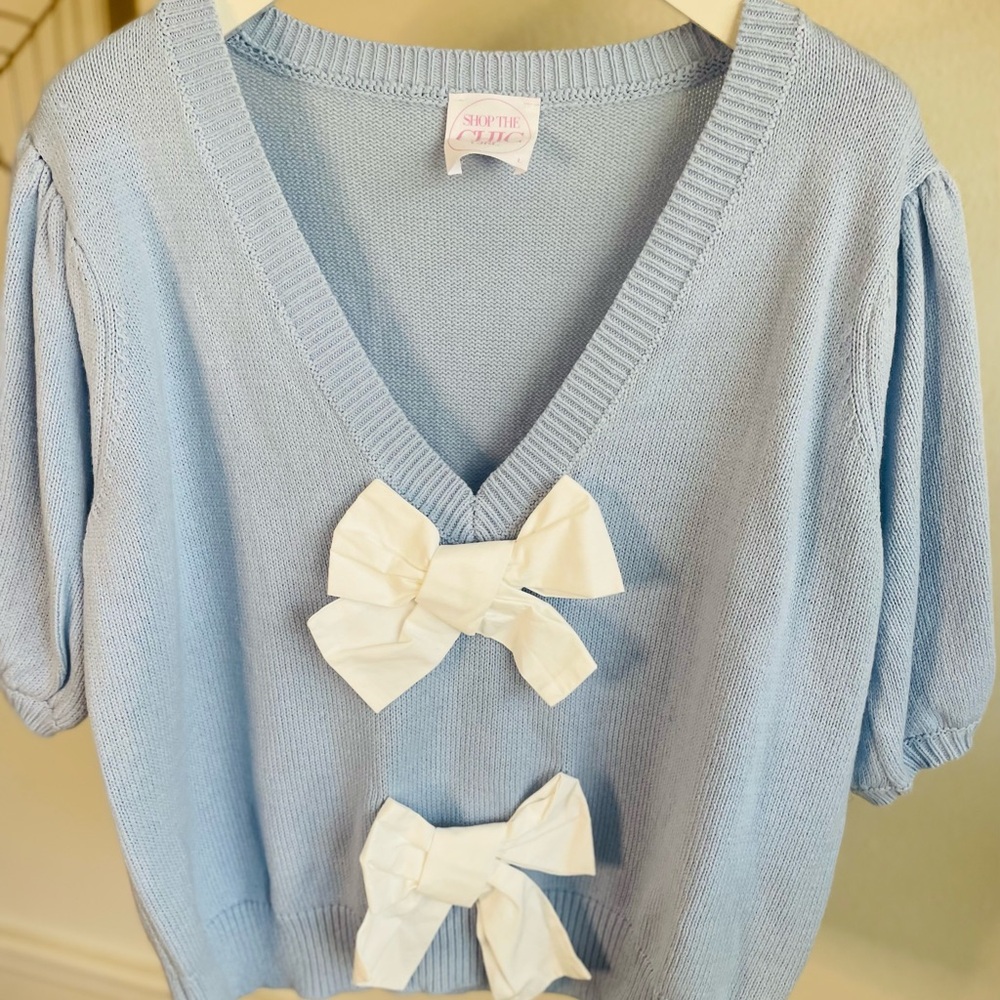 Light Blue Sweater with White Bows